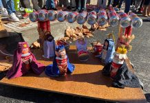 FOTOS | Los Cortijillos anuncia la llegada de los Reyes Magos con el arrastre de latas
